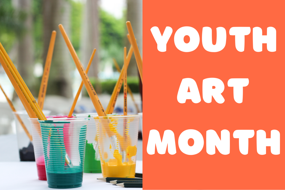 Paint cups with brushes sticking out and and orange box with the title youth art month on top